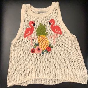A knit woven white tank top with flamingos